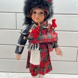 Leonardo Collector’s Porcelain Doll “The Piper”, 15” tall